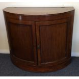 A Georgian mahogany hinged top domed front chest.