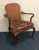 An elm carver chair on four cabriole legs. Est. £5