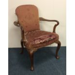 An elm carver chair on four cabriole legs. Est. £5
