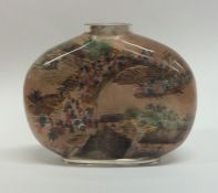 An unusual glass scent bottle decorated with Chine