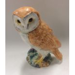 A Beswick figure of an owl with outstretched claws