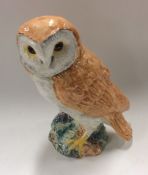 A Beswick figure of an owl with outstretched claws