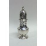 A Georgian baluster shaped silver caster on spread