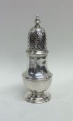 A Georgian baluster shaped silver caster on spread