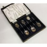 A boxed set of six silver bean top coffee spoons.