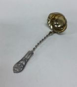 A Russian silver cream ladle with twisted stem and