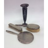 A silver three piece dressing table set together w