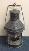 A large copper mounted ship's lamp, entitled, "Not
