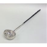 An Antique silver toddy ladle with fluted decorati