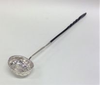 An Antique silver toddy ladle with fluted decorati