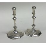 A good pair of George I style taper candlesticks.