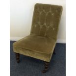 A small Edwardian button back nursing chair. Est.