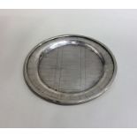 A circular Irish silver waiter of fluted design. A