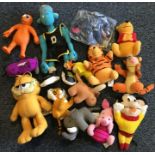 A bag containing various plush and other toys to i