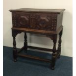 A Georgian oak bible box with hinged lid on matchi