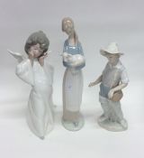 A Lladro figure of a shepherdess together with two