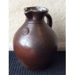 SVENBAYER: A tall baluster shaped pottery ewer wit
