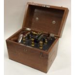 A mahogany cased shock machine. Est. £20 - £30.