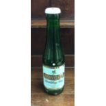 An oversized novelty glass Babycham bottle in the