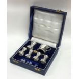 A good quality cased silver cruet set. London. By