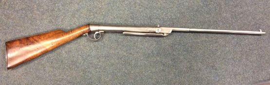 An Antique air rifle with mahogany stock. Est. £60