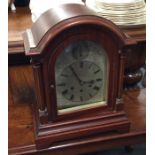 A Westminster chime mahogany mantle clock with flu