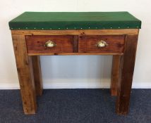 A stripped pine two drawer table together with one