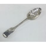 A Georgian silver fiddle pattern berry spoon of ty