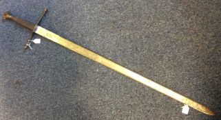A large steel sword with rope twist handle and eng