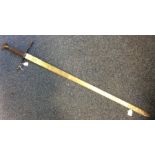 A large steel sword with rope twist handle and eng