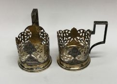 A pair of Russian silver gilt cup holders with nie