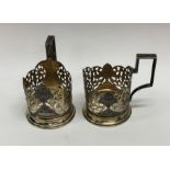 A pair of Russian silver gilt cup holders with nie