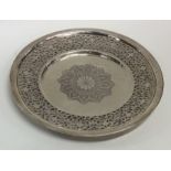 A circular Persian silver letter tray with pierced