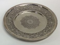 A circular Persian silver letter tray with pierced
