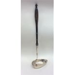 A large Antique Russian silver ladle with pouring