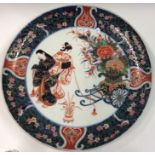 A large Japanese charger decorated with figures. S