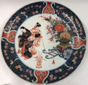 A large Japanese charger decorated with figures. S