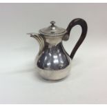 A small heavy French silver water jug with fluted