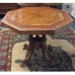 A Victorian walnut inlaid occasional table on four