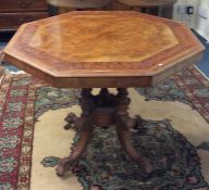 A Victorian walnut inlaid occasional table on four