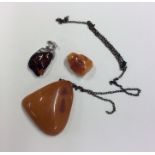 A large amber pendant etc. Approx. 83 grams. Est.