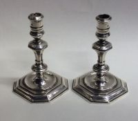 A pair of Georgian style cast silver taper candles