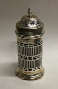 A silver pierced sugar shaker with BGL. Approx. 22