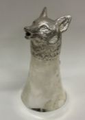 A large cast stirrup cup in the form of a fox's he