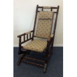 An American rocker with upholstered seat. Est. £30