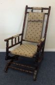 An American rocker with upholstered seat. Est. £30