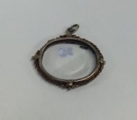 An early Georgian silver locket embossed with flow