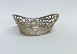 A small Dutch pierced silver basket with scroll de