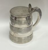 A Georgian silver tankard with reeded tapering sid