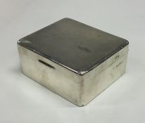 A silver engine turned hinged top cigarette box. B